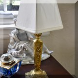 D06. One of a pair of small brass lamps. 